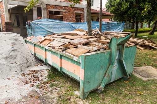 Professionals assessing a garage for clearance in Willesden