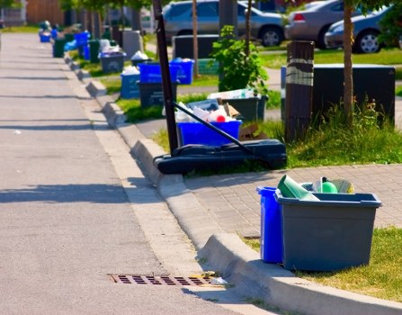 Staff scheduling a commercial rubbish collection on a tablet